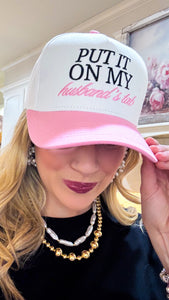 Put It on My Husbands Tab Trucker Hat